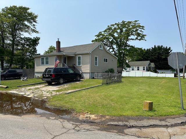 159 Forest Rd E, Mastic Beach, NY 11951 - view of home's exterior featuring a chimney