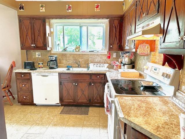 159 Forest Rd E, Mastic Beach, NY 11951 - kitchen with white appliances, under cabinet range hood, tasteful backsplash, and light countertops