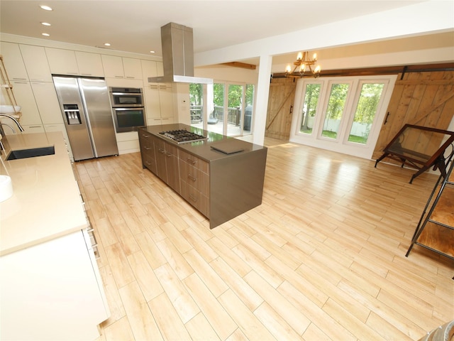 35 Junard Blvd, Port Jefferson Station, NY 11776 - kitchen with a sink, stainless steel appliances, modern cabinets, a kitchen island, and island range hood