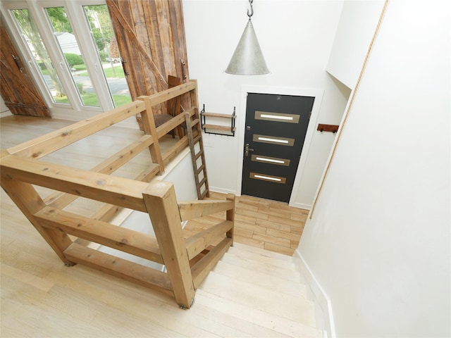35 Junard Blvd, Port Jefferson Station, NY 11776 - stairs with wood finished floors and baseboards