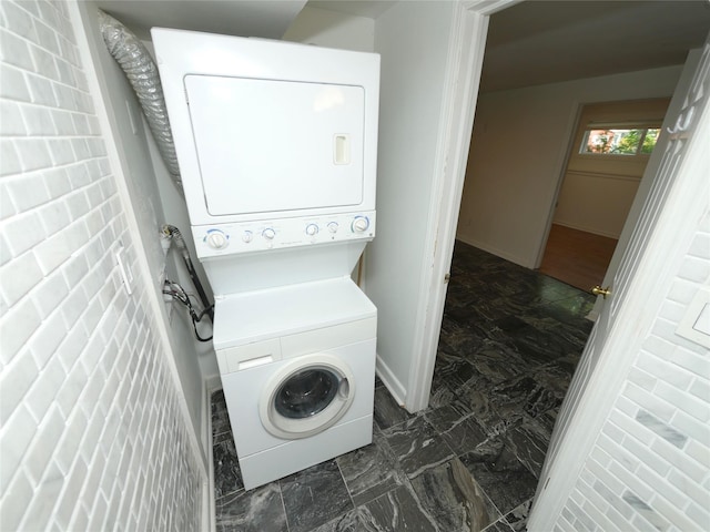 35 Junard Blvd, Port Jefferson Station, NY 11776 - laundry area featuring stacked washer / dryer and baseboards