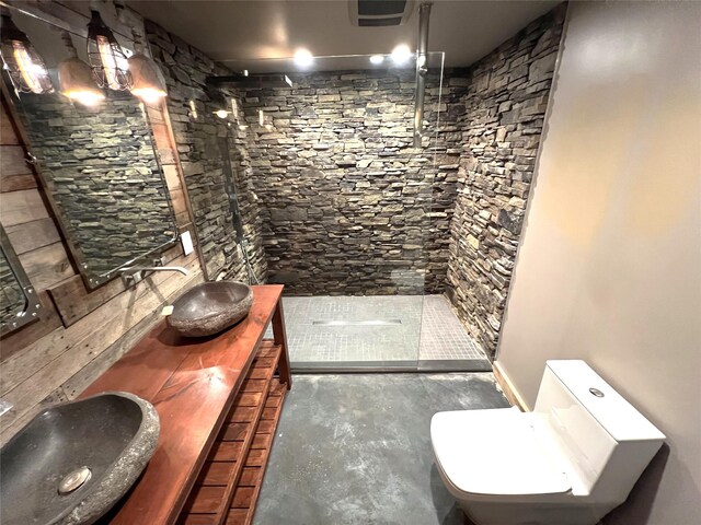 35 Junard Blvd, Port Jefferson Station, NY 11776 - full bathroom with walk in shower, double vanity, toilet, and concrete floors