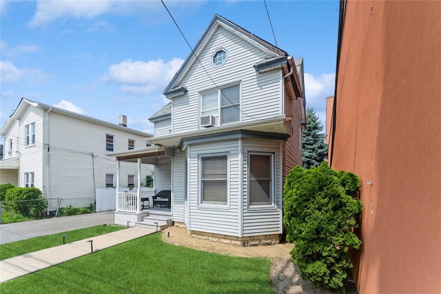 45 4th St, Valley Stream, NY 11581 - view of front of house featuring a front lawn and covered porch