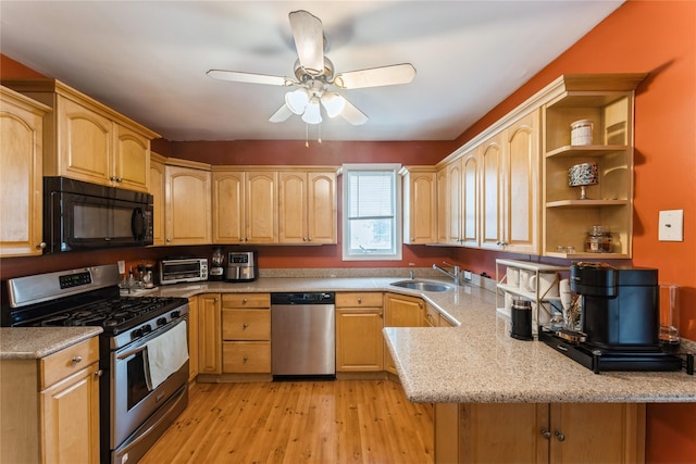 45 4th St, Valley Stream, NY 11581 - kitchen featuring appliances with stainless steel finishes, light brown cabinetry, and light wood-type flooring