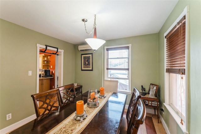 45 4th St, Valley Stream, NY 11581 - dining room featuring a wall mounted AC and wood finished floors