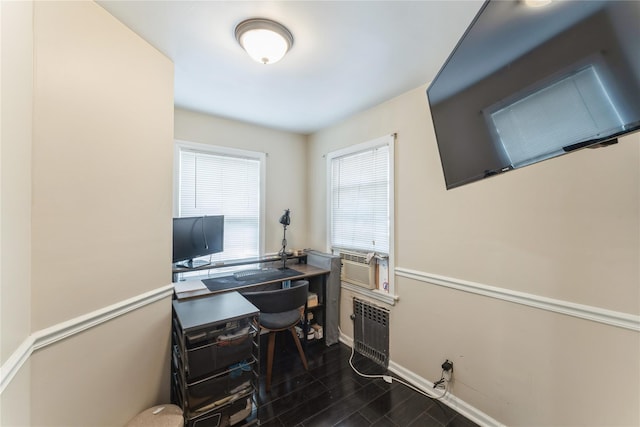 45 4th St, Valley Stream, NY 11581 - office area featuring dark wood-style flooring, cooling unit, and radiator