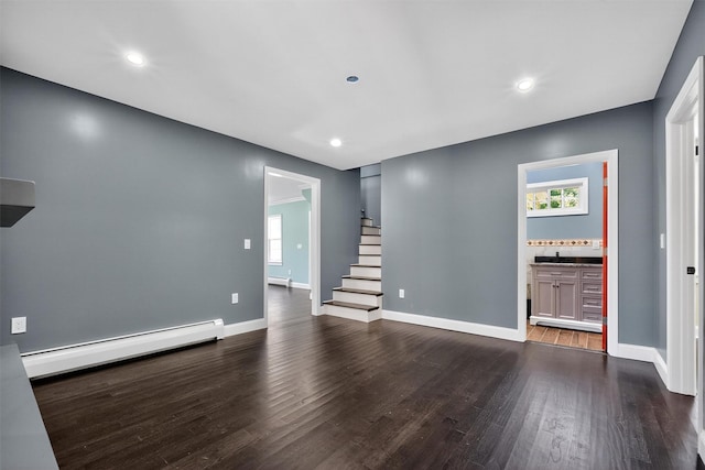 104 S Quaker Ln, Hyde Park, NY 12538 - unfurnished living room featuring a baseboard radiator, dark wood-style floors, stairs, recessed lighting, and a baseboard heating unit