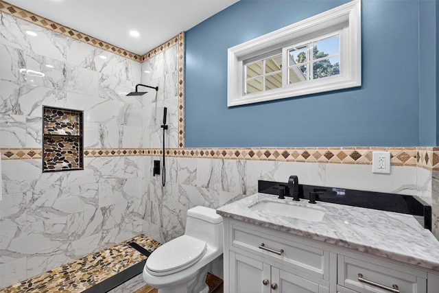 104 S Quaker Ln, Hyde Park, NY 12538 - bathroom with vanity, tiled shower, tile walls, a wainscoted wall, and recessed lighting