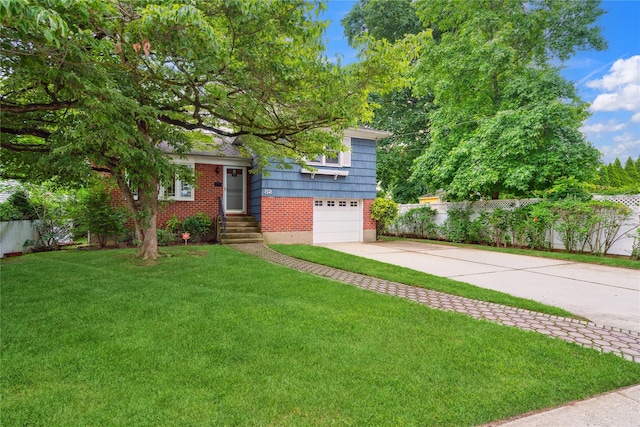 82 Cherry Ln, Lynbrook, NY 11563 - tri-level home with brick siding, concrete driveway, and a garage