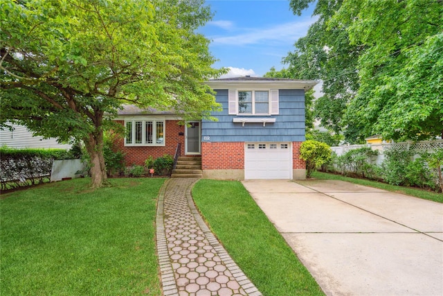 82 Cherry Ln, Lynbrook, NY 11563 - split level home with driveway, brick siding, and a garage