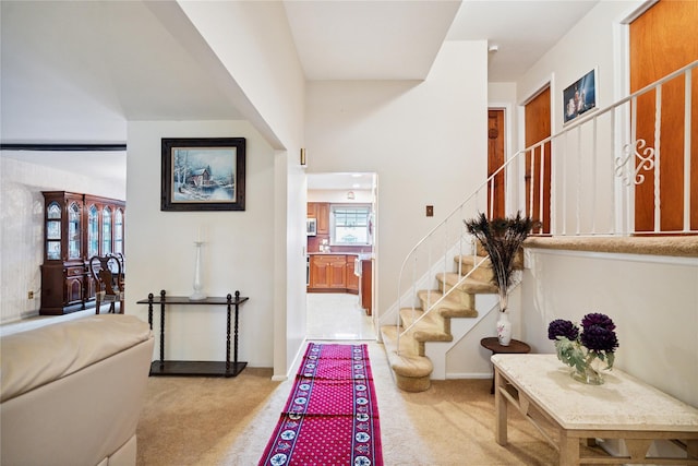 82 Cherry Ln, Lynbrook, NY 11563 - corridor featuring light colored carpet and stairs
