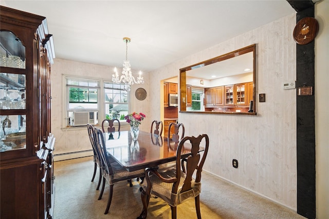 82 Cherry Ln, Lynbrook, NY 11563 - dining area with light colored carpet, a chandelier, a baseboard radiator, and cooling unit