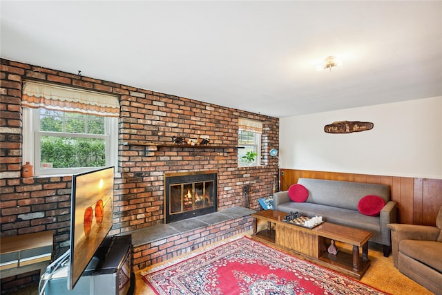 82 Cherry Ln, Lynbrook, NY 11563 - living area featuring a fireplace, plenty of natural light, a wainscoted wall, and wooden walls