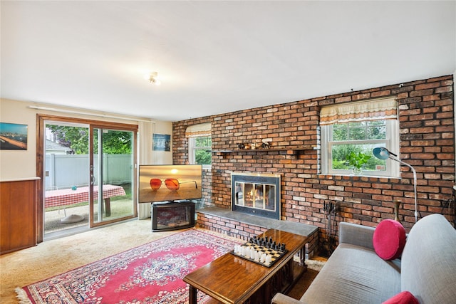 82 Cherry Ln, Lynbrook, NY 11563 - carpeted living room with a brick fireplace and brick wall