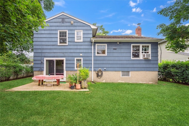 82 Cherry Ln, Lynbrook, NY 11563 - rear view of property with a chimney, cooling unit, and a patio area