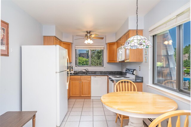 7-05 Briarcliff Dr S, Ossining, NY 10562 - kitchen featuring white appliances, dark countertops, light tile patterned floors, ceiling fan, and pendant lighting