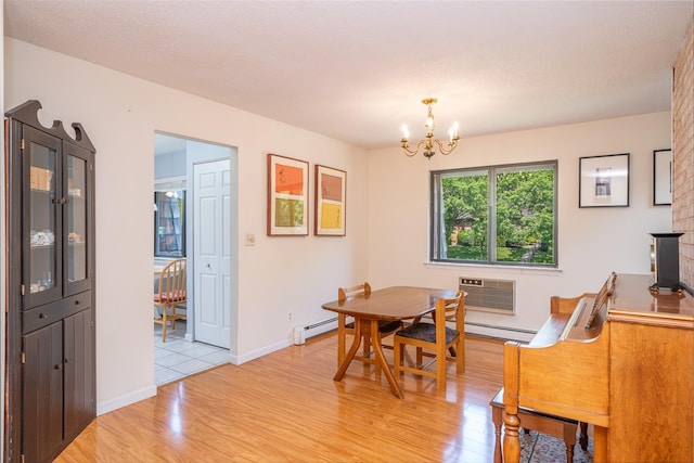 7-05 Briarcliff Dr S, Ossining, NY 10562 - dining space with light wood-style flooring, a chandelier, an AC wall unit, baseboards, and a baseboard radiator