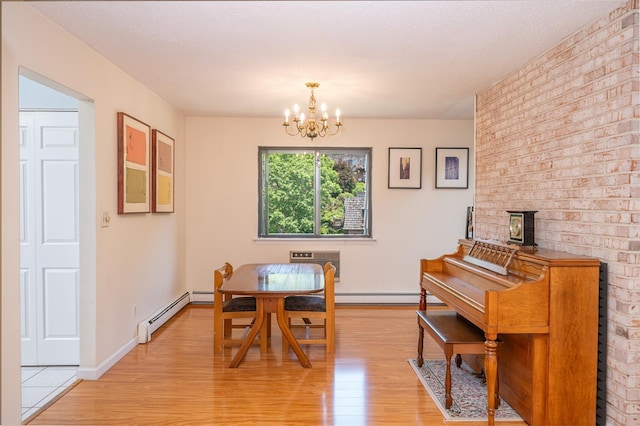 7-05 Briarcliff Dr S, Ossining, NY 10562 - dining area with light wood-style flooring, a chandelier, baseboard heating, and a wall unit AC