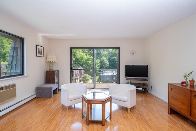 7-05 Briarcliff Dr S, Ossining, NY 10562 - living area with a baseboard heating unit, light wood-style flooring, and a wall mounted AC