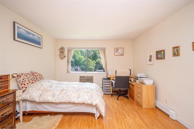 7-05 Briarcliff Dr S, Ossining, NY 10562 - bedroom with a baseboard radiator, light wood-style floors, an office area, and a wall mounted AC