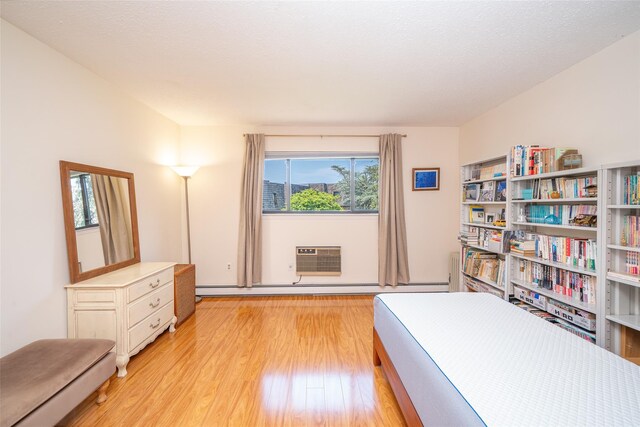 7-05 Briarcliff Dr S, Ossining, NY 10562 - bedroom featuring light wood-style flooring and a wall mounted AC