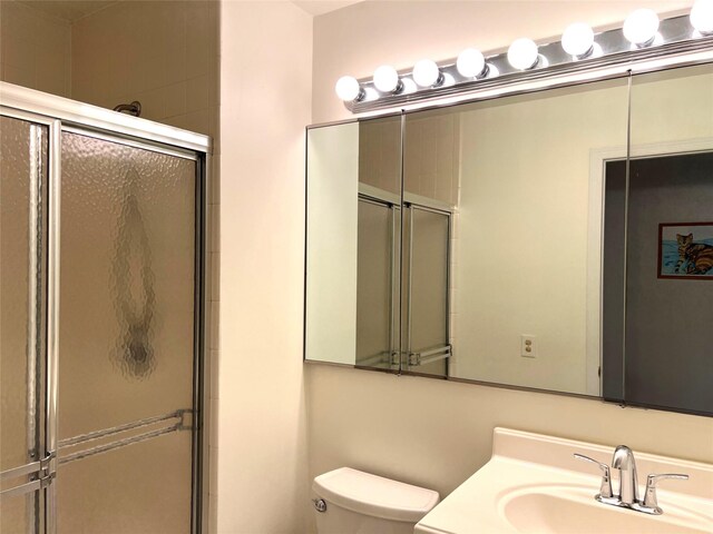 7-05 Briarcliff Dr S, Ossining, NY 10562 - bathroom with toilet, a shower with shower door, and vanity