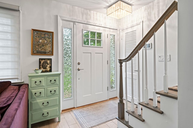 183 Iceland Dr, South Huntington, NY 11746 - foyer entrance featuring a chandelier and stairs