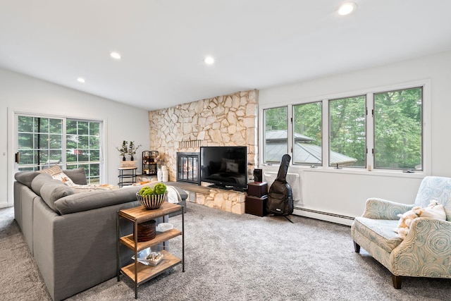 183 Iceland Dr, South Huntington, NY 11746 - carpeted living room featuring a baseboard heating unit, recessed lighting, a stone fireplace, and vaulted ceiling