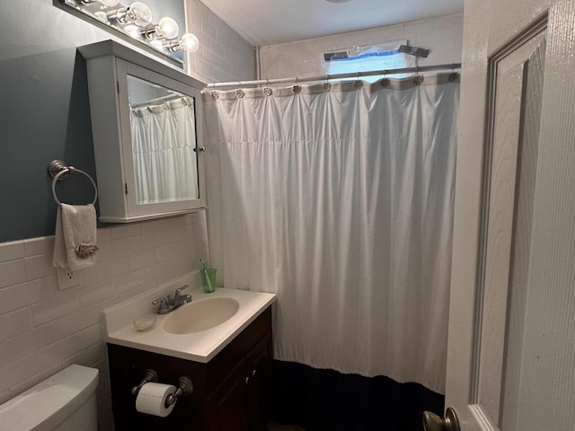 2 Paulding St, Huntington, NY 11743 - bathroom featuring vanity, toilet, a shower with curtain, and tile walls