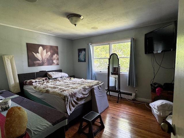 2 Paulding St, Huntington, NY 11743 - bedroom featuring hardwood / wood-style floors and a baseboard radiator