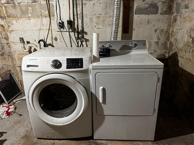 2 Paulding St, Huntington, NY 11743 - laundry room with washer and dryer and concrete block wall