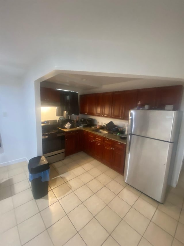 1457 Rosedale Ave, Bronx, NY 10460 - kitchen with appliances with stainless steel finishes, light tile patterned floors, dark countertops, a sink, and dark brown cabinets