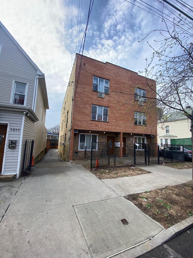 1457 Rosedale Ave, Bronx, NY 10460 - view of front facade with driveway and a fenced front yard