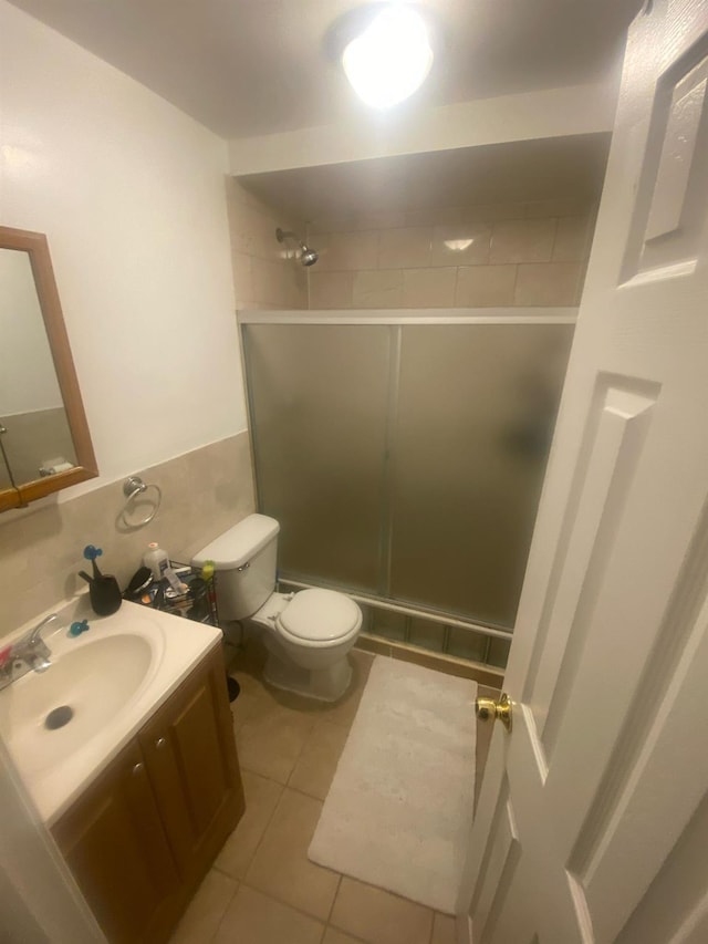 1457 Rosedale Ave, Bronx, NY 10460 - bathroom with tile patterned flooring, vanity, a shower stall, and toilet