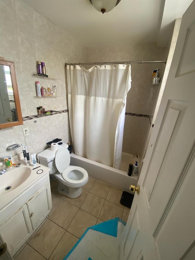 1457 Rosedale Ave, Bronx, NY 10460 - bathroom featuring shower / tub combo, vanity, tile patterned flooring, toilet, and tile walls