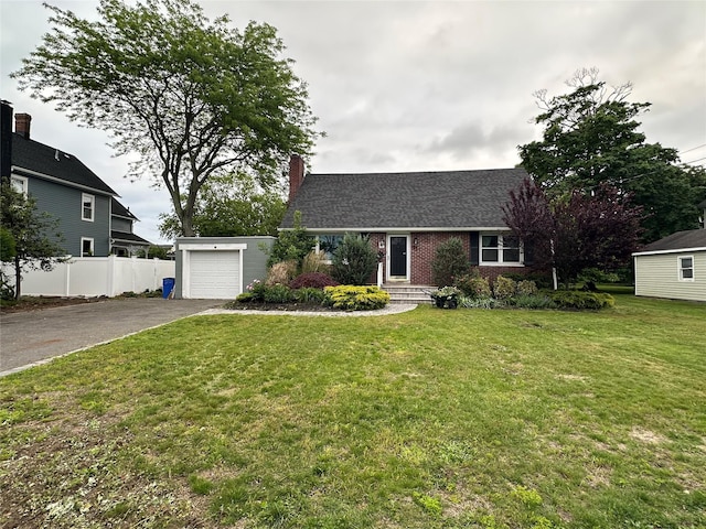 417 S Ocean Ave, Patchogue, NY 11772 - view of front of home with driveway, a chimney, brick siding, an attached garage, and a shingled roof