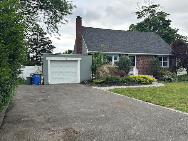 417 S Ocean Ave, Patchogue, NY 11772 - cape cod-style house with asphalt driveway, a shingled roof, and a chimney