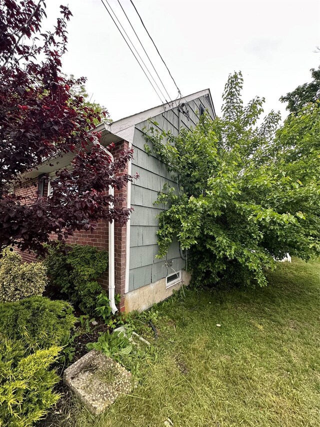 417 S Ocean Ave, Patchogue, NY 11772 - view of property exterior with a lawn