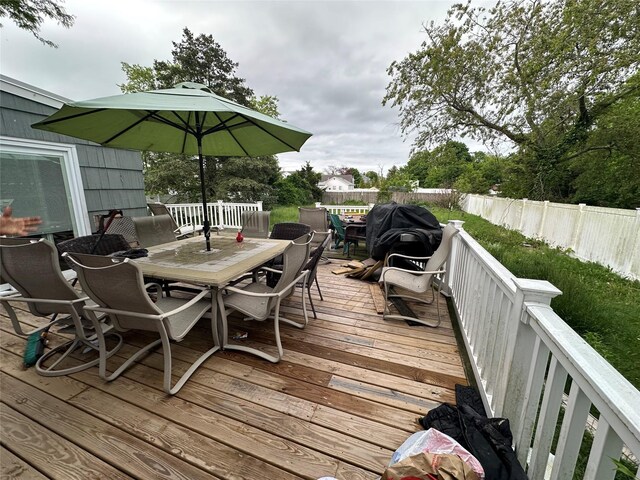 417 S Ocean Ave, Patchogue, NY 11772 - wooden terrace featuring outdoor dining area and a fenced backyard