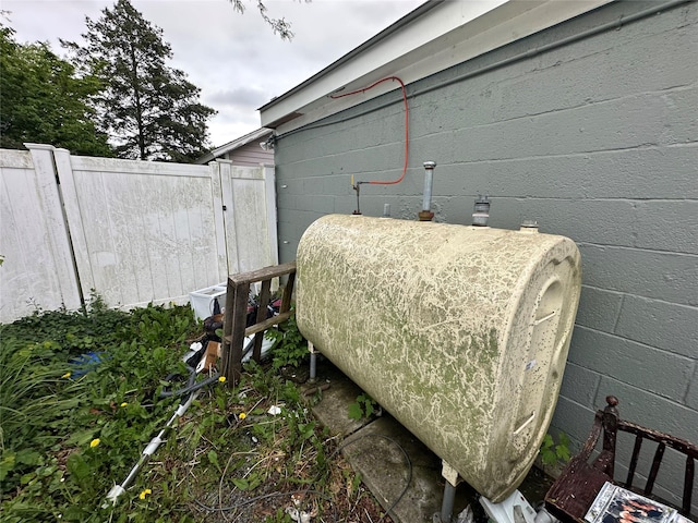 417 S Ocean Ave, Patchogue, NY 11772 - exterior view of concrete block siding and heating fuel