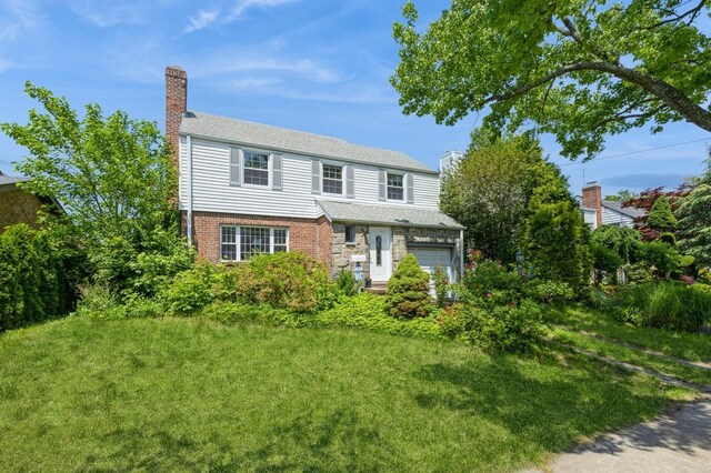 16249 13th Ave, Beechhurst, NY 11357 - view of front facade featuring a chimney, a garage, and brick siding