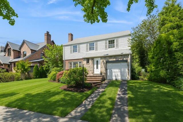 16249 13th Ave, Beechhurst, NY 11357 - view of front of home featuring driveway, a front yard, stone siding, and a garage