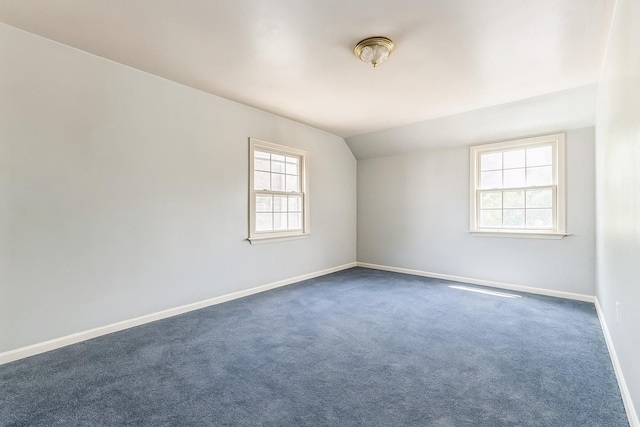16249 13th Ave, Beechhurst, NY 11357 - spare room with baseboards, vaulted ceiling, and dark carpet