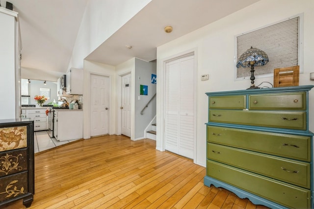 405 Waukena Ave, Oceanside, NY 11572 - foyer entrance with light wood finished floors and stairs