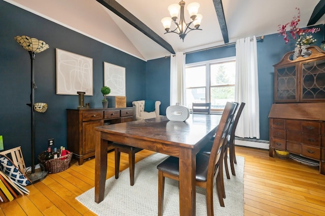 405 Waukena Ave, Oceanside, NY 11572 - dining space with a chandelier, light wood finished floors, and a baseboard heating unit