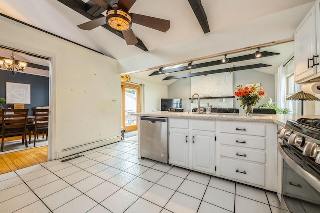405 Waukena Ave, Oceanside, NY 11572 - kitchen featuring appliances with stainless steel finishes, white cabinets, a chandelier, light countertops, and a peninsula