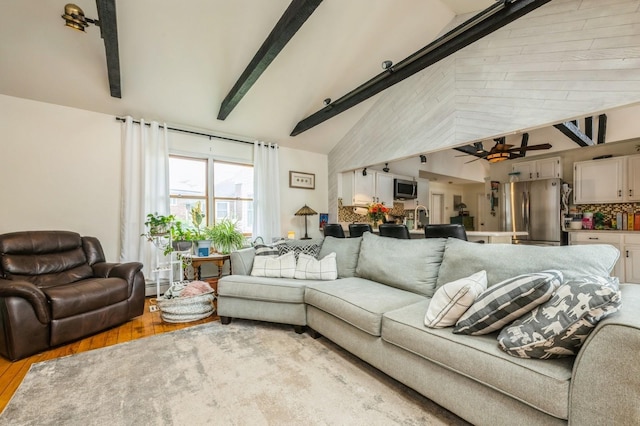 405 Waukena Ave, Oceanside, NY 11572 - living room featuring wood finished floors, beam ceiling, a ceiling fan, and high vaulted ceiling