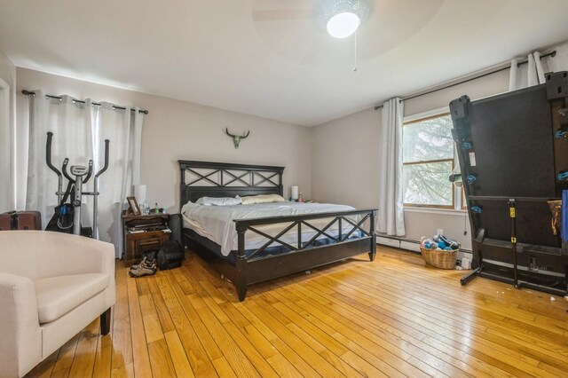 405 Waukena Ave, Oceanside, NY 11572 - bedroom with light wood-style flooring and ceiling fan