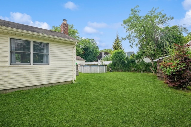 405 Waukena Ave, Oceanside, NY 11572 - view of grassy yard with an outdoor pool