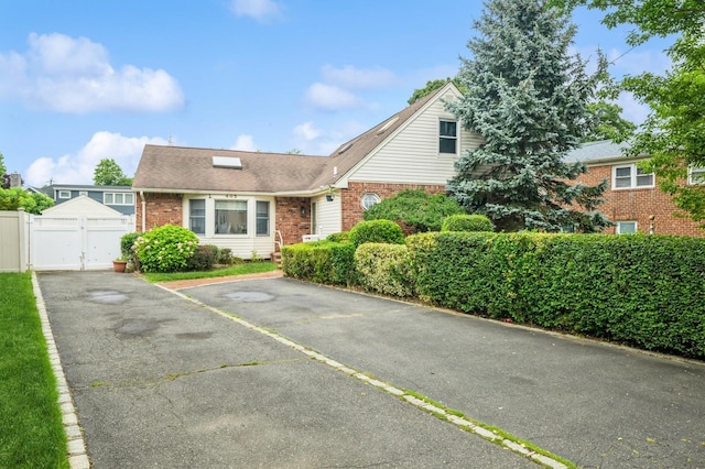 405 Waukena Ave, Oceanside, NY 11572 - view of front of house with brick siding and a gate
